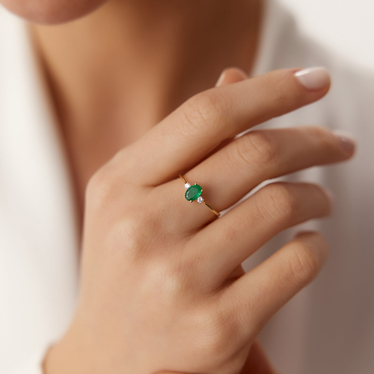 Round emerald green stone ring in platinum and cz -